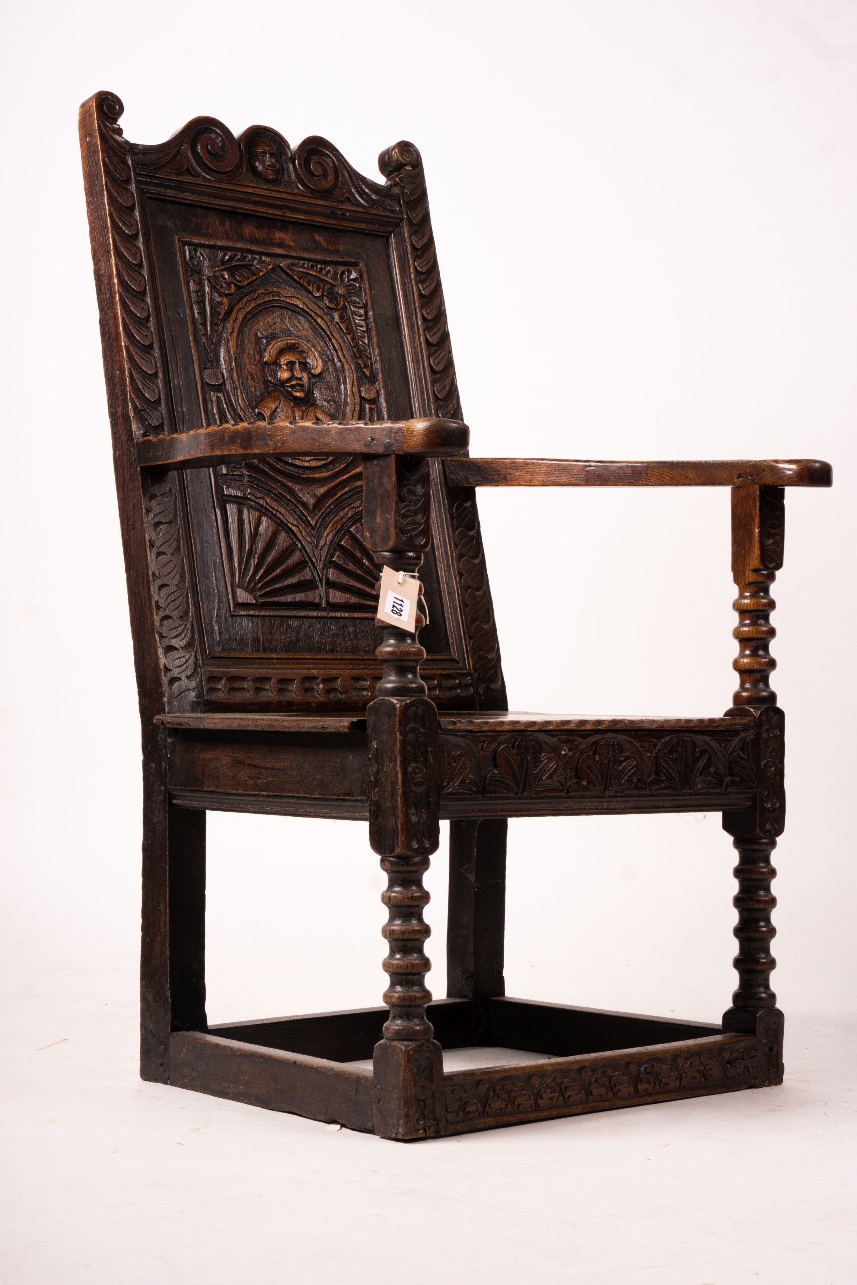 An 18th century style carved oak wainscot chair, width 56cm, depth 60cm, height 101cm